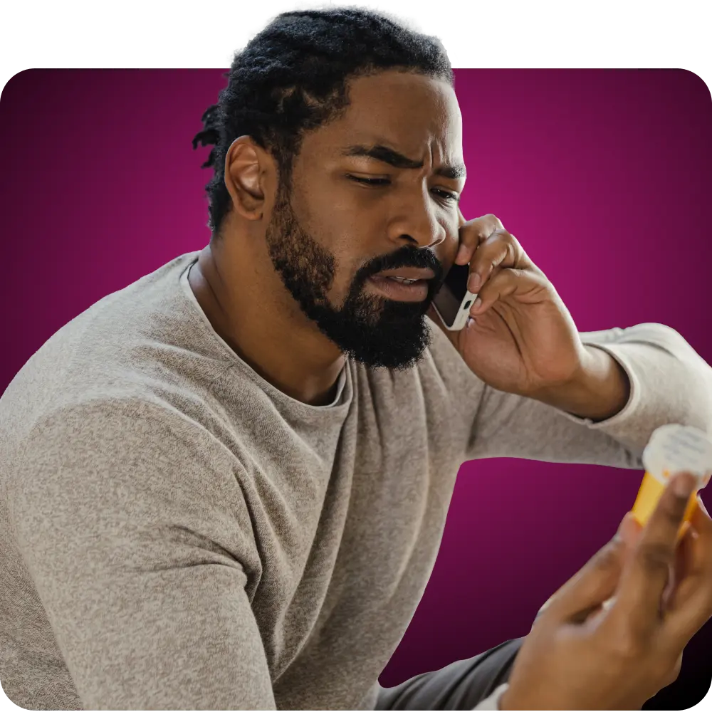 Man in grey sweater discussing his doxy-PEP medication over the phone